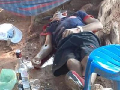 Human trashed, shot and left with knife in the eye