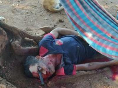 Human trashed, shot and left with knife in the eye