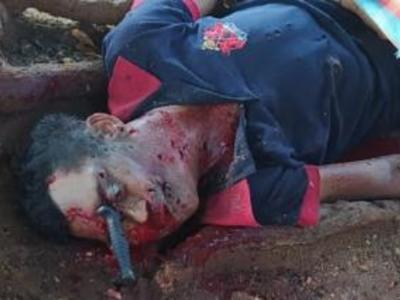 Human trashed, shot and left with knife in the eye