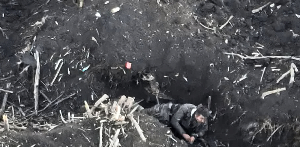 The immediate aftermath of a high-explosive mine blast...