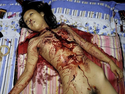 Woman stabbed to death with a partial autopsy at the scene