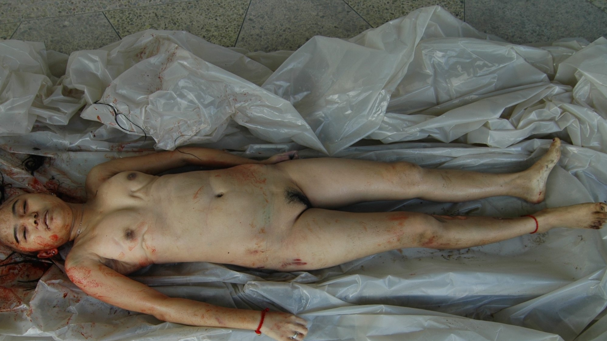 Brutally murdered Chinese woman - Autopsy