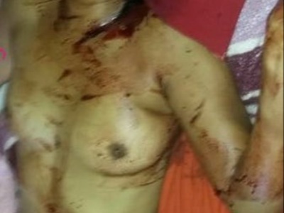 Nude woman killed in her bed by her husband.