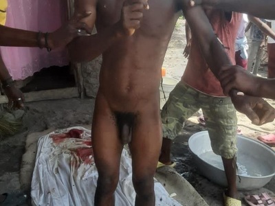 Haitian gang members showing their beheaded rival