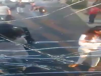 Crazy women break crystal to truck by traffic accident.