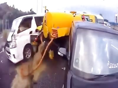 Sewage truck valve pops after pile-up spilling sewage.