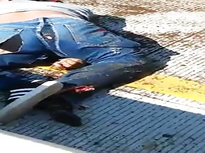 The street is stained with corpses