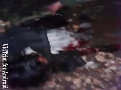 Soldiers show killed oponents.