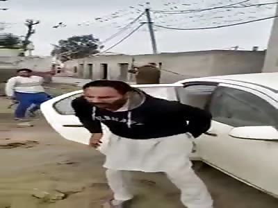 Indian police officer cranes civilians.