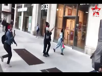 Police protect an injured Jew during protests in New York