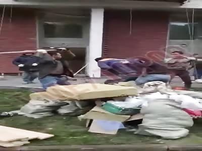 Russians fight with sticks and shovels.
