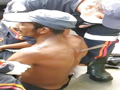 Man Is Calm With A Knife Blade In His Back 