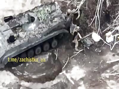 UA Soldiers load corpses into a transporter