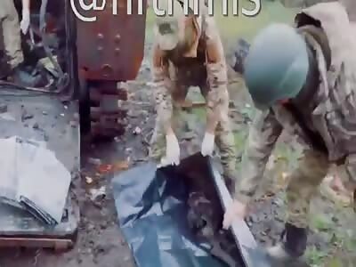 AFU troops clean out remains of their fallen from APC