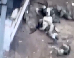 Russian soldier gets hit in the back...