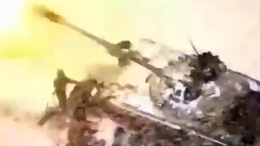 RU soldier falls after a tank fires right next to him