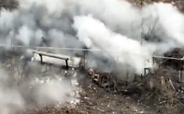 An artillery hit on a Russian position collapses a small house