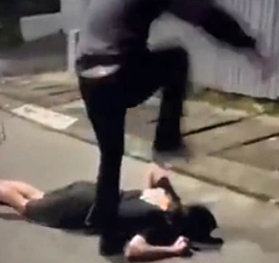 Kicking a downed guy