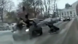 In Russia, a car hits a woman with a carriage