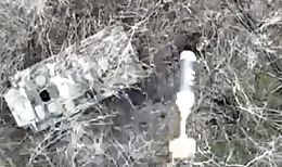 Orc standing next to BMP attacked by drone