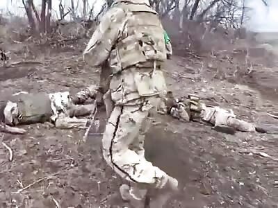 UA soldiers show KIA Wagner troops after taking their position