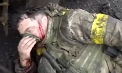  UAF soldier evacuates an injured UA officer