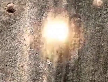 RU soldier tries to roll away from a drone-dropped grenade