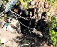 Orcs hit by artillery and a casualty is seen being dragged