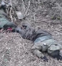 Ukrainian soldier shows KIA Russians and their captured weapons