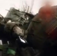 Ukrainian combat medic applies aid 