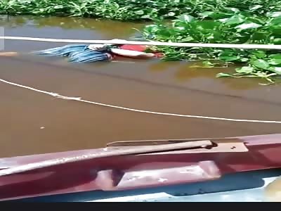 Corpse with hands tied in a lake