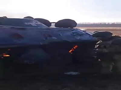 Destroyed Vehicle and Charred Bodies