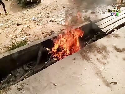 Thief set on fire in a ditch.