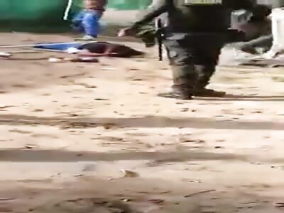 Robbery suspect beaten in front of police