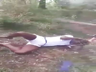 Man with dyed hair is punished with kicks and a shot in the hand