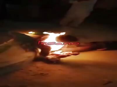 Thief is set on fire on a staircase