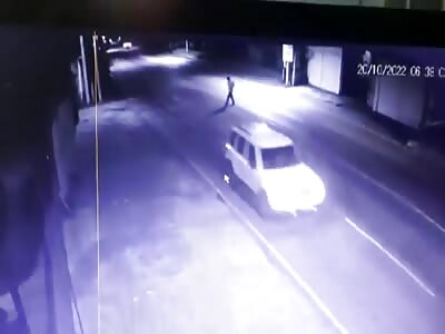 Man turns a pizza roll on asphalt