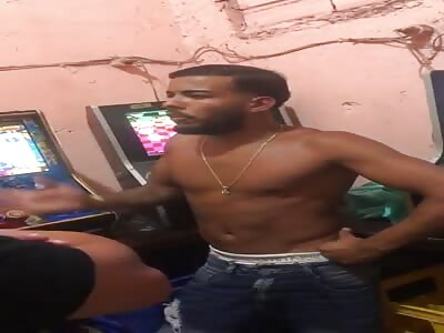 Thief being beaten for scamming a gambling house.