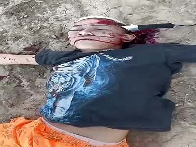 Dead with a knife stuck in his head.