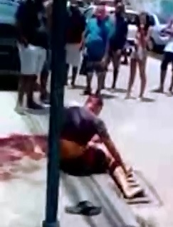 Strange Scene..Thugs Shot by Police Sit as People just Stare at Them 