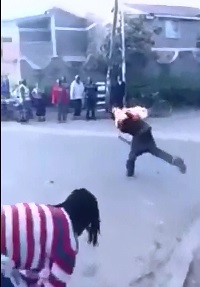 Brutal..Thief caught is Burned Alive  and Stoned with Cinder Block 