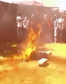 2 Men Burning Alive Ablaze as the Townsfolk go about their Night 