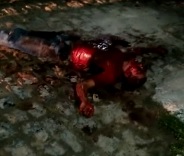 Thug Covered in Blood Agonizes