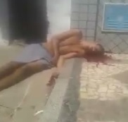 Dude Agonizing on Sidewalk after Being Shot in the Head