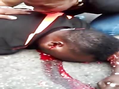 Hysterical Woman Cries over Dead Husband