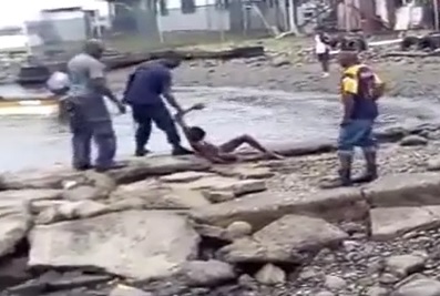 Dude Beaten to a Bloody Pulp on Rocks by the Water