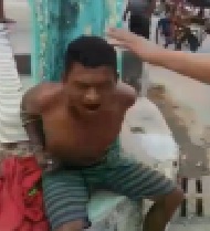 Tied to a Pole and Beaten by Crowd