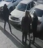 Walk up Rifle Execution on Two Men Talking on a Sidewalk