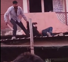 Crazy Dude with a 2x4 on a Roof