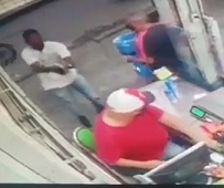 Chubby Clerk Cashes Out his Last Customer.